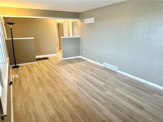 spare room featuring light wood-type flooring