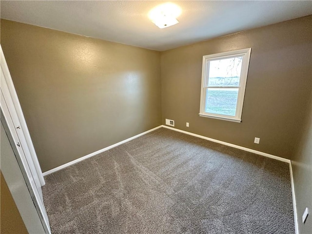 empty room featuring carpet floors