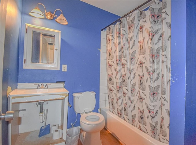 full bathroom featuring sink, shower / tub combo with curtain, wood-type flooring, and toilet