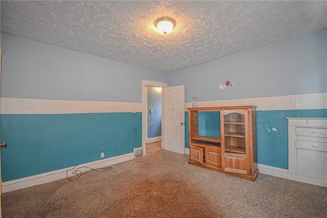 unfurnished bedroom with a textured ceiling