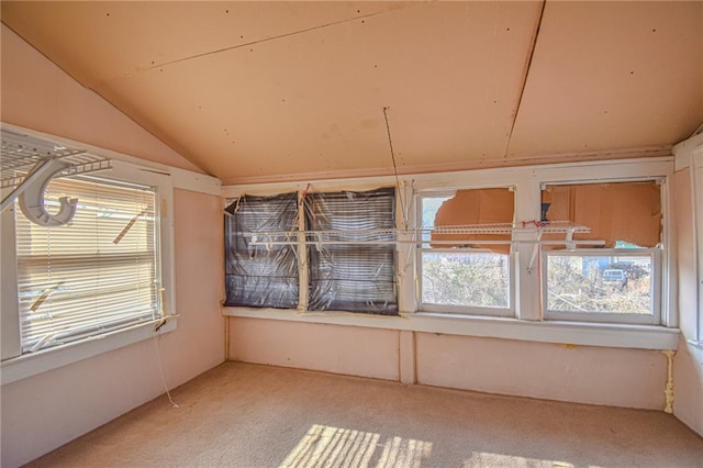 unfurnished sunroom featuring lofted ceiling