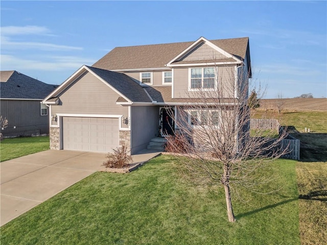 view of front of house with a garage and a front lawn