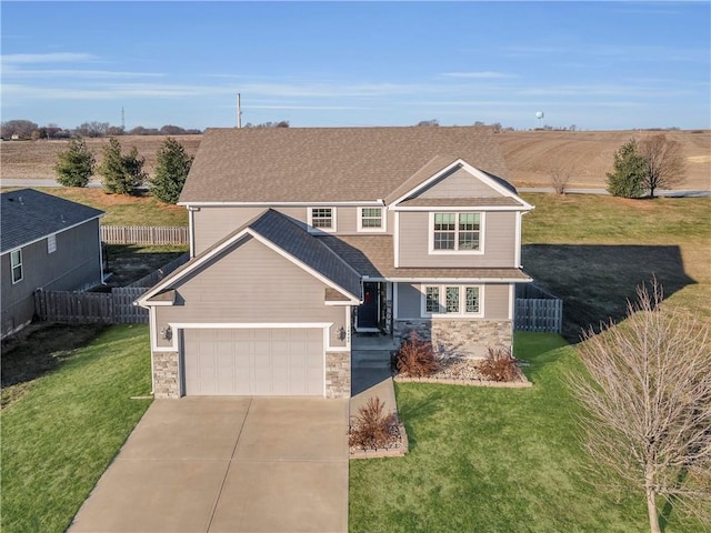 view of front of house with a rural view and a front yard