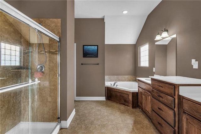 bathroom with plus walk in shower, vanity, and vaulted ceiling