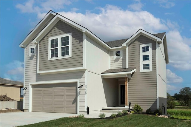 front facade featuring a garage and a front lawn