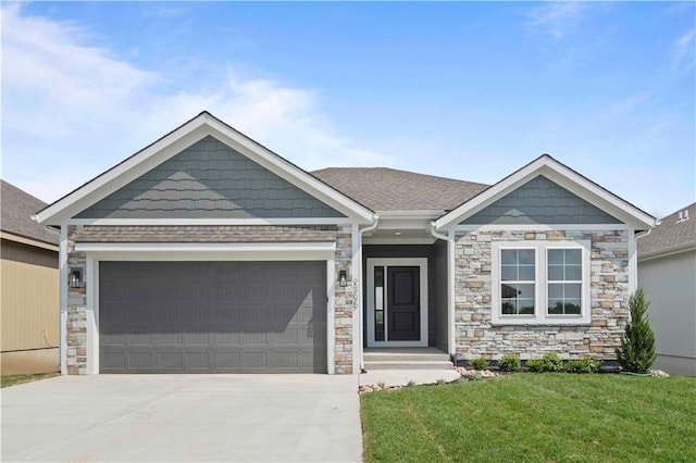 view of front of house featuring a garage and a front lawn