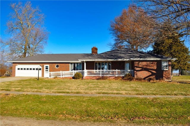 ranch-style home featuring a garage and a front yard