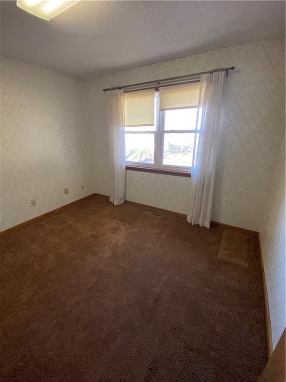 empty room featuring carpet