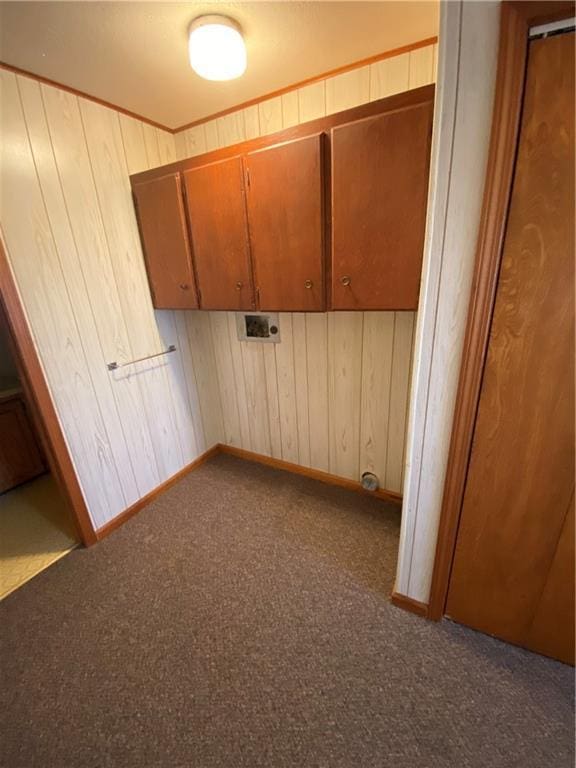 interior space featuring carpet flooring and wood walls