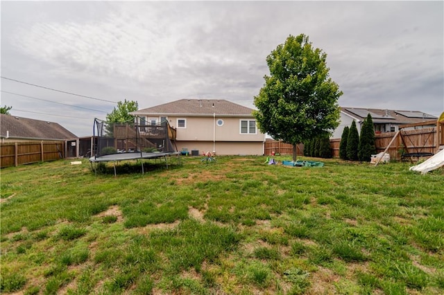 1702 Arrowhead Dr, Atchison, KS 66002 - view of yard featuring a trampoline and a deck