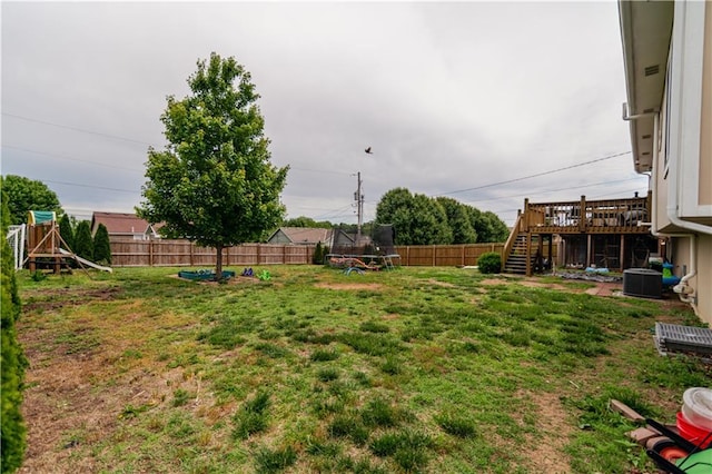 1702 Arrowhead Dr, Atchison, KS 66002 - view of yard with a trampoline, stairs, and central AC unit