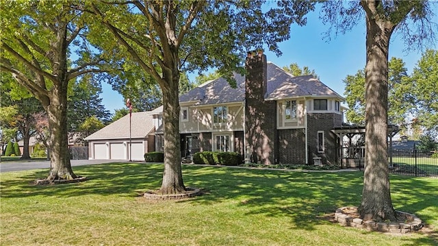 view of front facade with a front yard and a garage