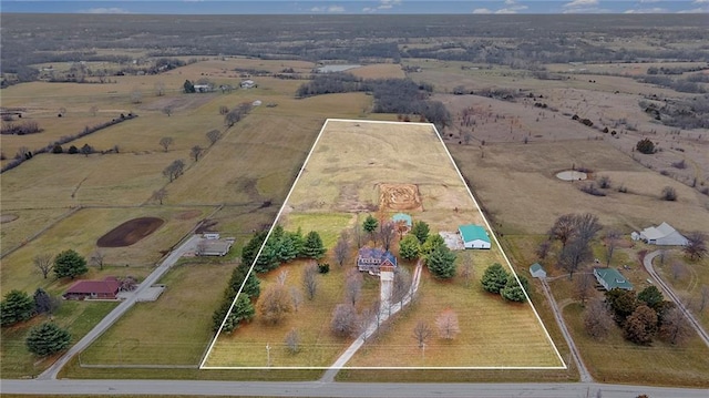 birds eye view of property with a rural view