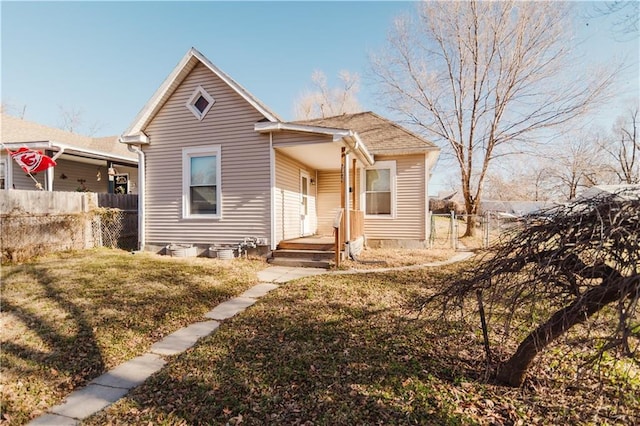 bungalow-style house featuring a front yard