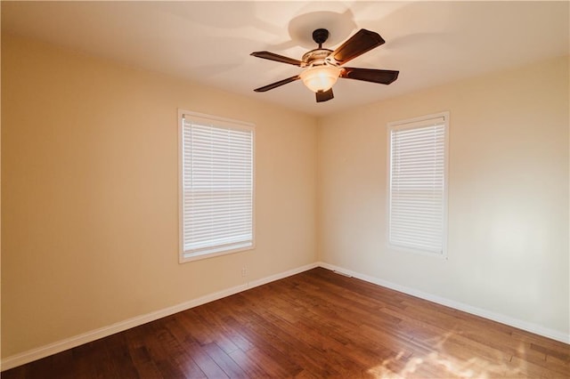 unfurnished room with hardwood / wood-style flooring and ceiling fan