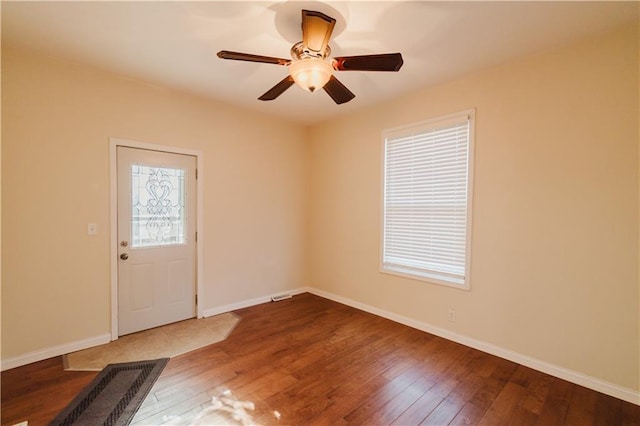 empty room featuring ceiling fan and hardwood / wood-style flooring