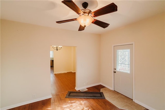 interior space featuring hardwood / wood-style floors and ceiling fan