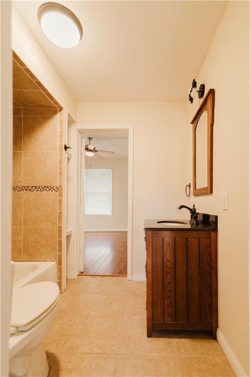 full bathroom featuring vanity, tile patterned floors, ceiling fan, toilet, and shower / bath combination