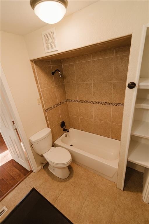 bathroom featuring toilet and shower / bath combination