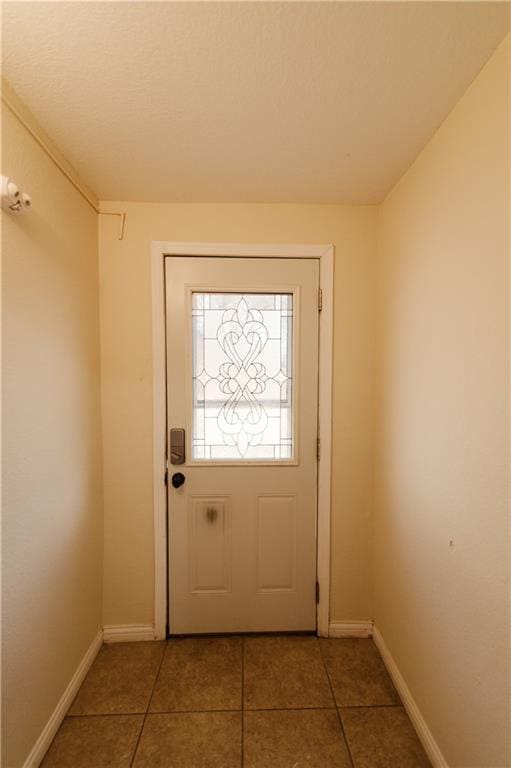 doorway featuring tile patterned flooring