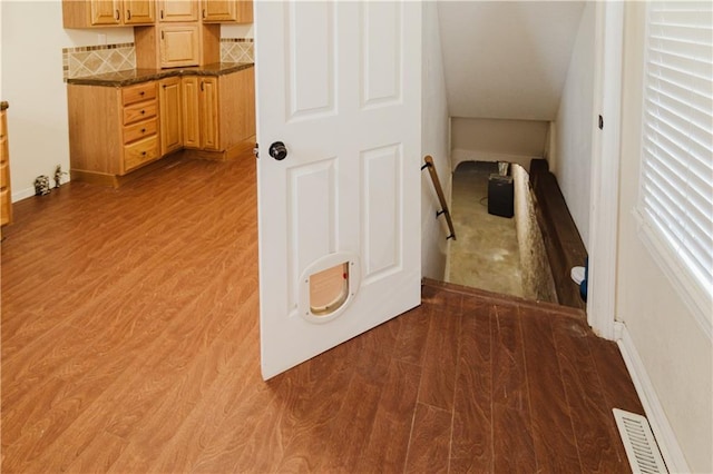 hall with hardwood / wood-style floors