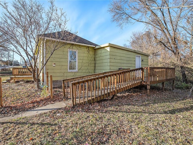 back of property featuring a wooden deck