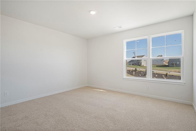 unfurnished room with carpet flooring