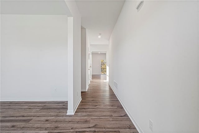 hall with wood-type flooring