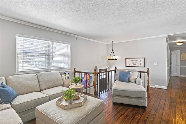 living room featuring crown molding, dark hardwood / wood-style flooring, and a textured ceiling