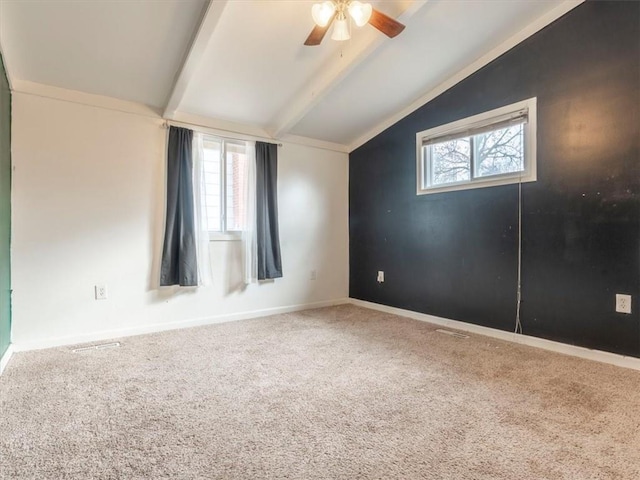 unfurnished room featuring carpet flooring, ceiling fan, and lofted ceiling with beams