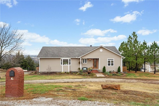 view of front of house featuring central AC and a front yard