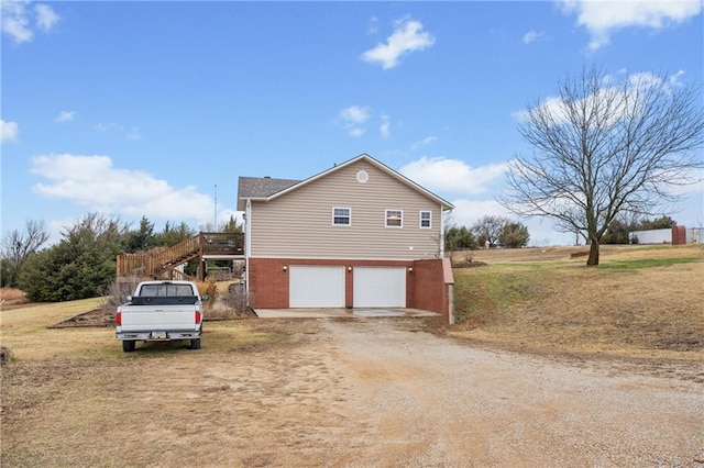 view of side of property with a garage