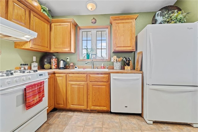 kitchen featuring light tile patterned floors, white appliances, ventilation hood, and sink