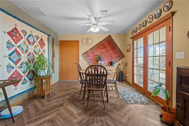 dining area with ceiling fan, parquet flooring, and french doors