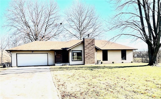 ranch-style home with a garage and a front yard