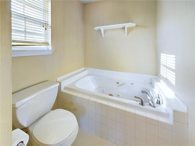 bathroom with a relaxing tiled tub and toilet