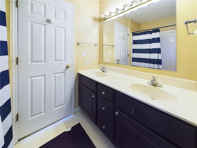 bathroom featuring vanity and a shower with curtain