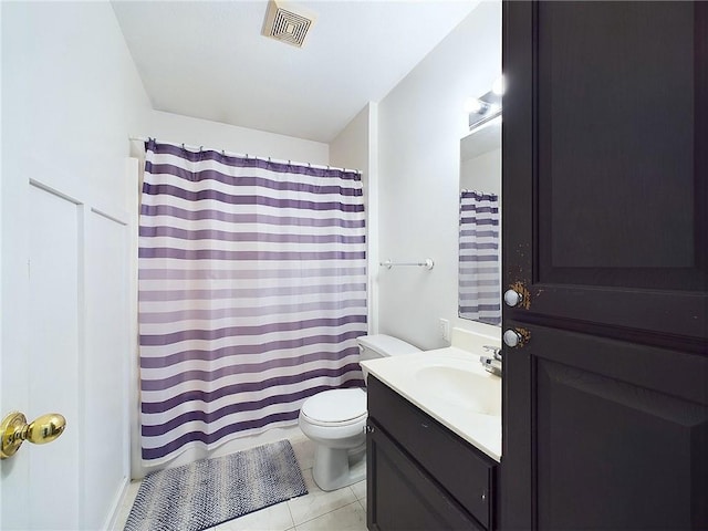 bathroom with tile patterned floors, toilet, and vanity