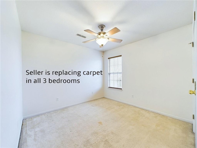 empty room with ceiling fan and light colored carpet