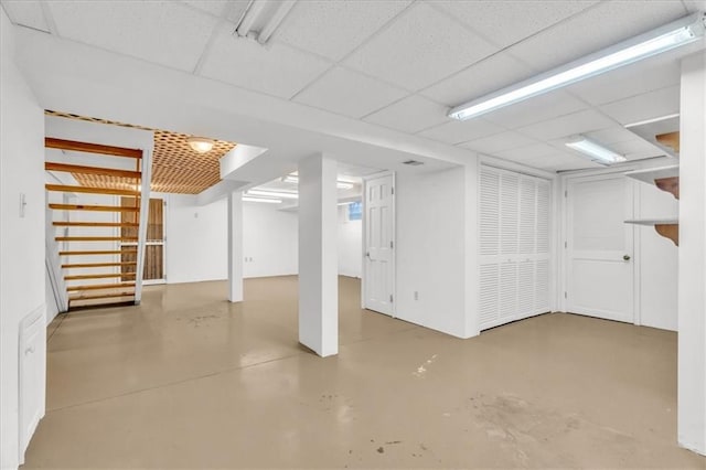 basement featuring a drop ceiling