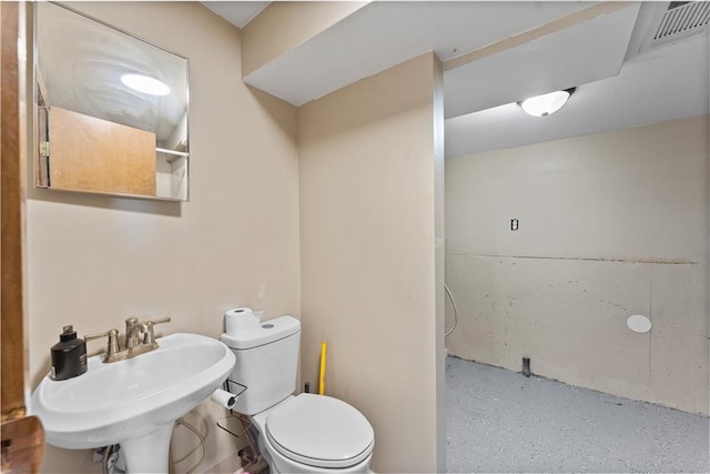 bathroom featuring sink and toilet