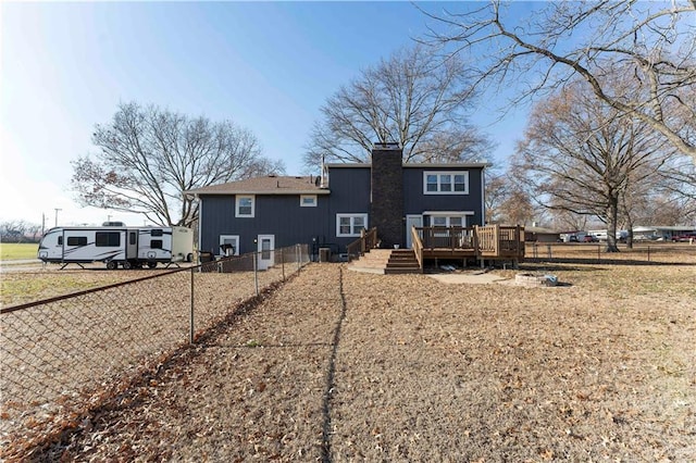 back of house with a deck and central AC unit