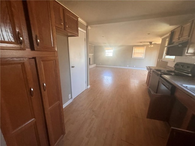 kitchen featuring black electric range, light hardwood / wood-style flooring, and ceiling fan