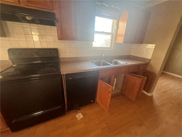 kitchen featuring exhaust hood, black appliances, sink, tasteful backsplash, and light hardwood / wood-style floors