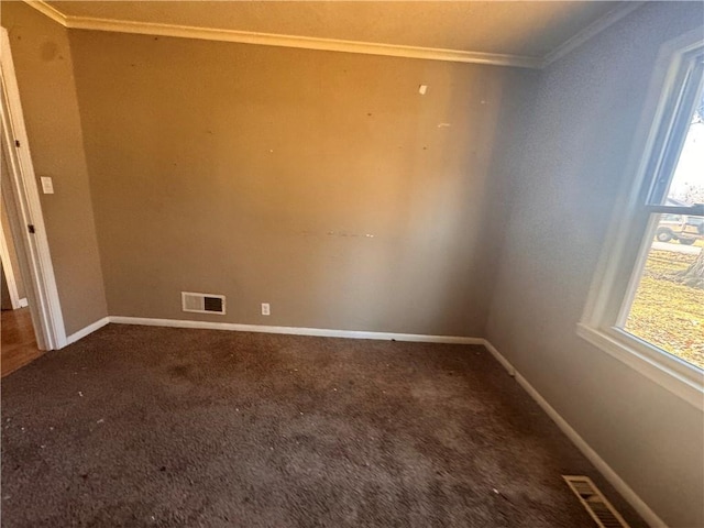 carpeted empty room featuring ornamental molding