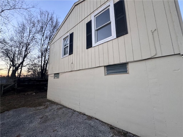 view of property exterior at dusk