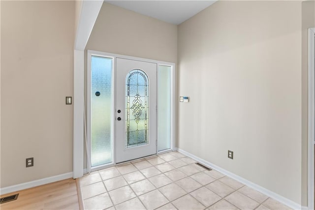 entrance foyer with visible vents and baseboards