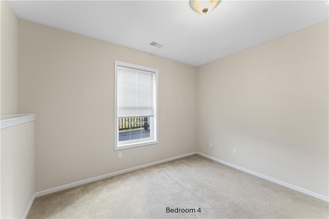 unfurnished room featuring light carpet, visible vents, and baseboards