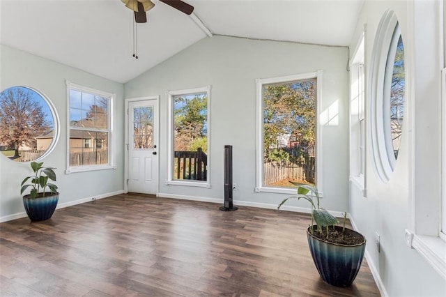 sunroom / solarium with ceiling fan and vaulted ceiling