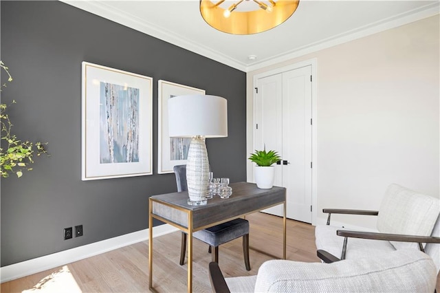 office space featuring wood finished floors, ornamental molding, and baseboards